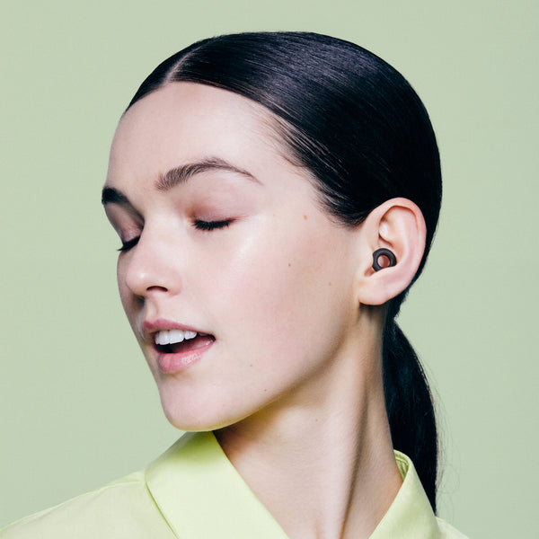Loop Quiet 2 black earplugs lifestyle shot — worn comfortably all day, all night