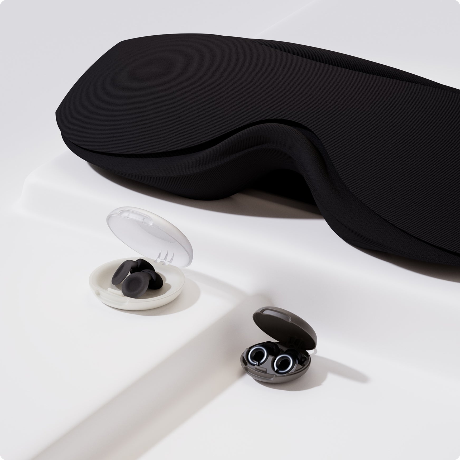 Loop Eclipse sleep mask, Loop Dream earplugs and Loop Switch earplugs on a white background